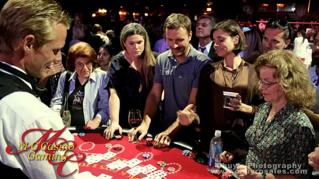 Guests playing at casino gaming tables during a Southern California casino night
