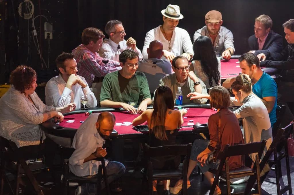 Guests enjoying a card game with a dealer at a casino party