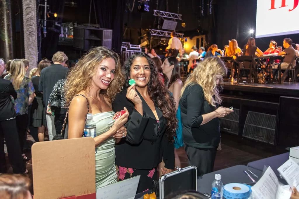 Guests mingling at a lively casino-themed party