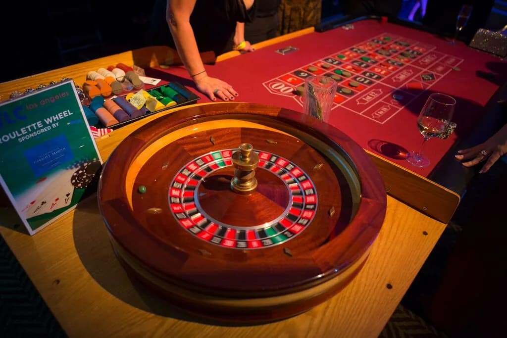 Guests enjoying casino games at a Los Angeles charity casino fundraiser