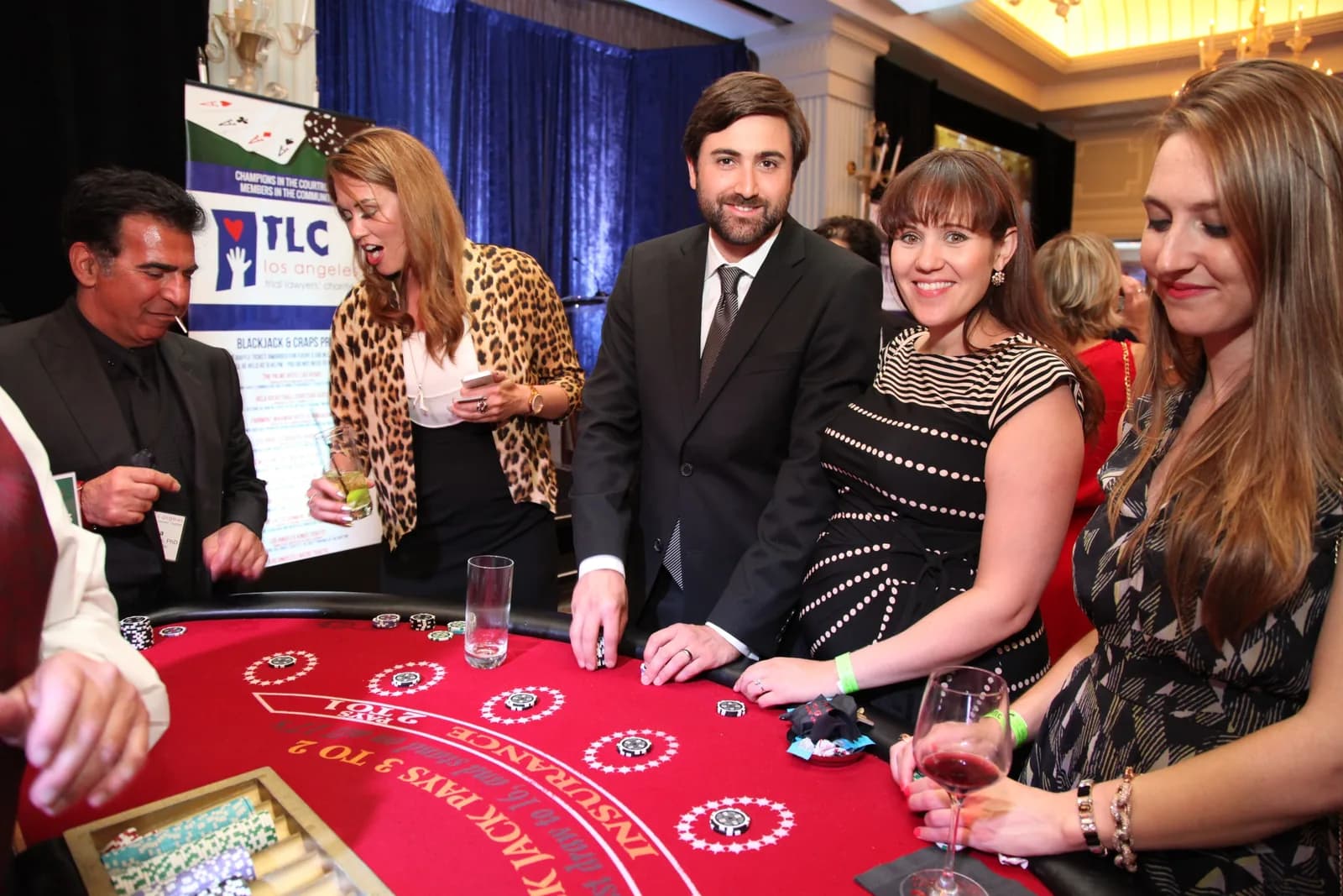 Branded casino tables set up for a Los Angeles Trial Lawyers Charities fundraiser event