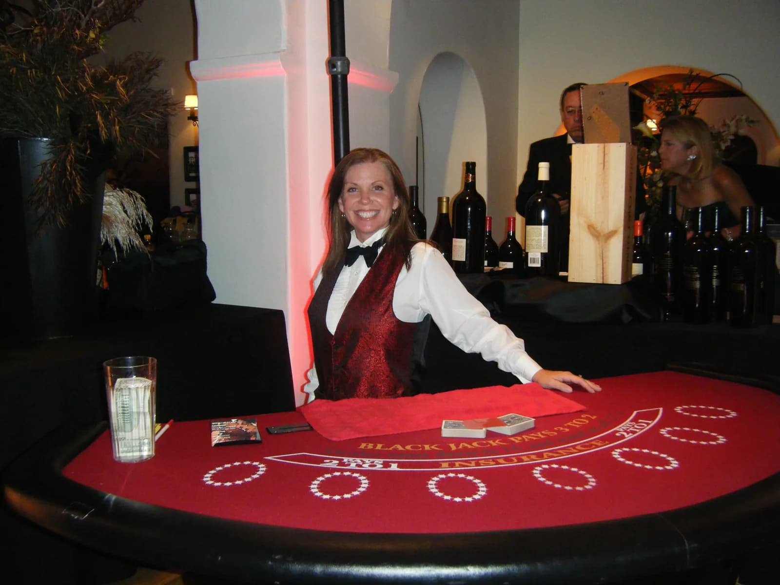 Professional dealer at a blackjack table during an upscale San Clemente mansion casino party